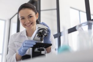 medium-shot-scientist-working-with-microscope